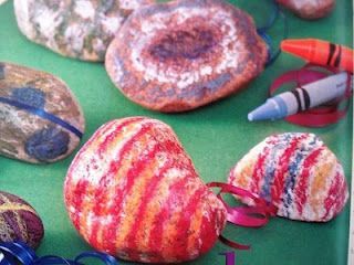Crayons on rocks. Place the rocks on a foil lined cookie sheet and bake them for