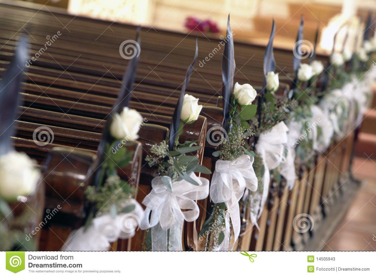 White rose decorated aisle in the church. -   Decoration for the church.