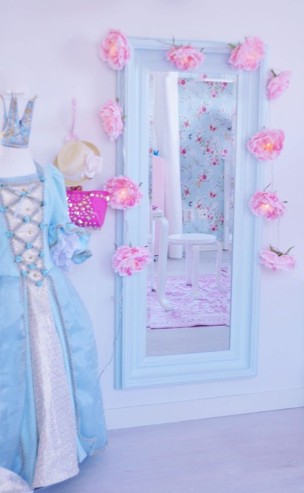 Dream bedroom for every little girl.  Look at her dress up gown.  Pastel pink an
