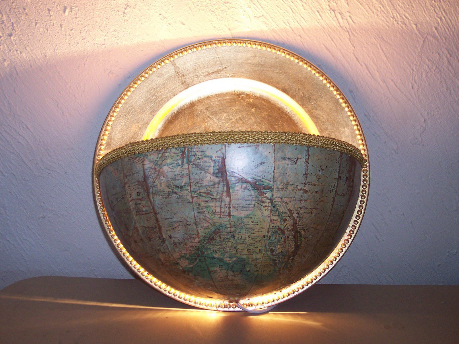 Globe Sconce I made using an old Globe and a Metallic Charger Plate!