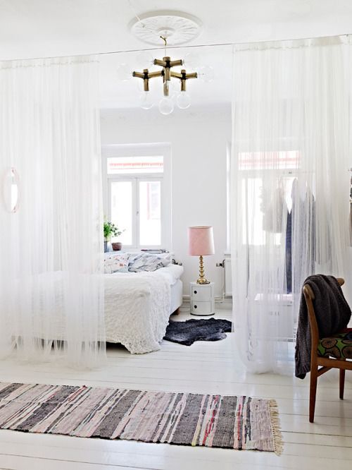 Sheer white room dividing curtains (on a ceiling mounted track?)