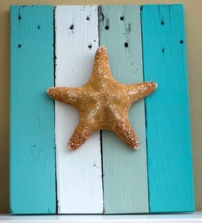 starfish or shells on painted boards. I could use my old wood floor planks!