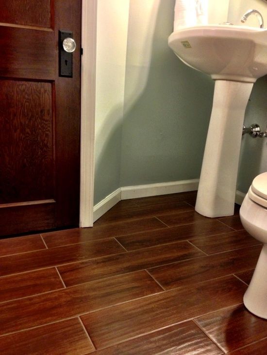 Tile that looks like wood. Great for wet areas in the home! I saw this on proper