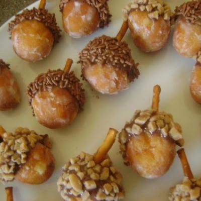 Acorns! Get glazed donut holes, dunk one end in Nutella or Chocolate Icing, roll