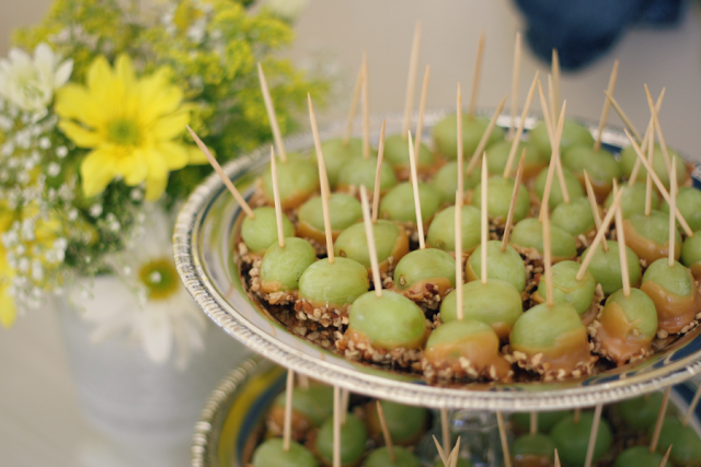 Baby shower food. Cold grapes dipped in caramel and peanuts.
