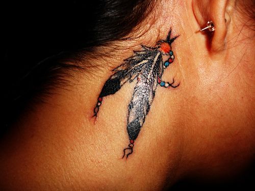 Behind the ear; feather tattoo