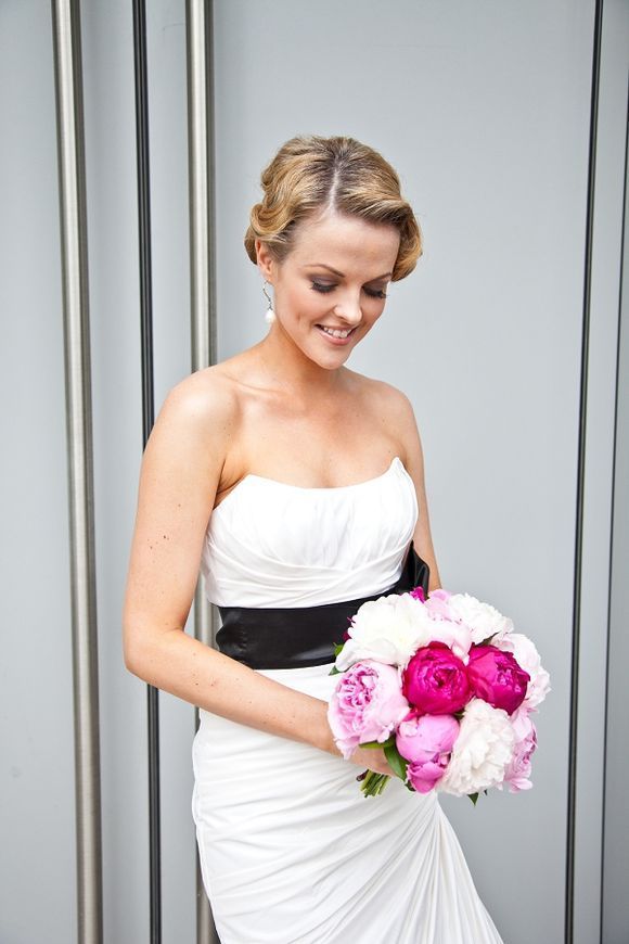 Black  White wedding dress, with a Pink flower bouquet. Gorgeous!  Would swap th