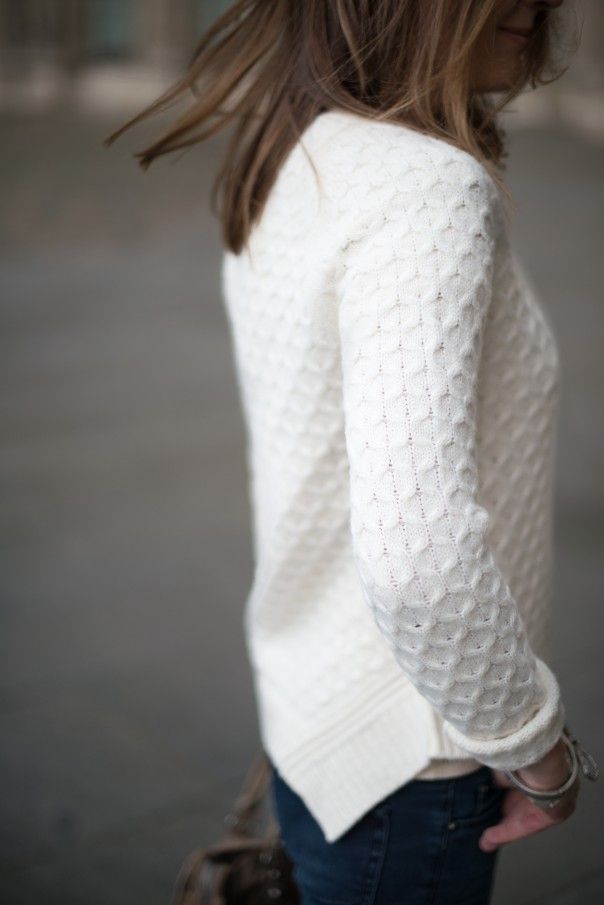 crisp white sweater.