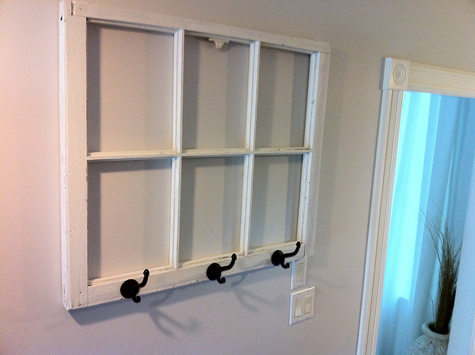 DIY coat rack from an old window with dry erase marker window panes