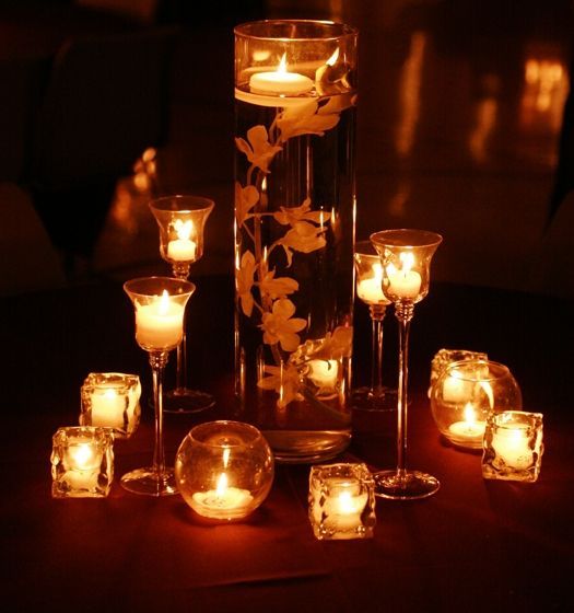 hmmm….candles for table centerpieces. a pretty alternative to lots of flowers?