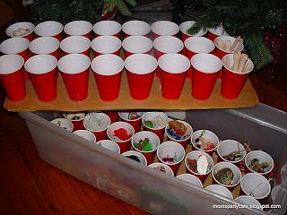 Hot glue cups to cardboard and store Christmas ornaments in them in tubs.