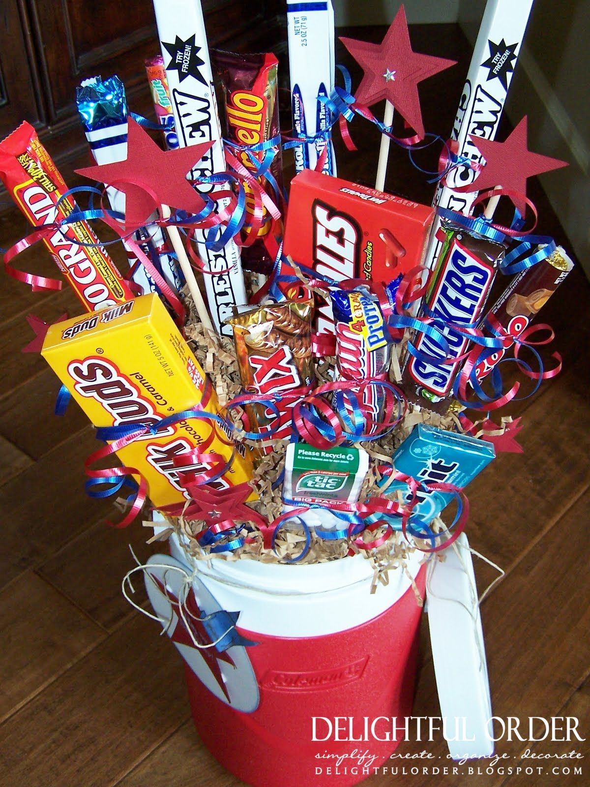 I like this gift basket idea in a big water jug… good for an athlete, play wit