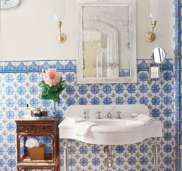 In a Michael Smith bathroom, blue- and-white tiles are a richer version of wains