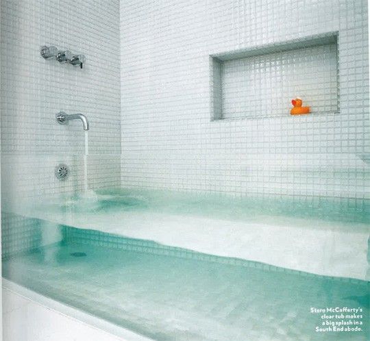 Invisible tub / Made from a thick sheet of glass inserted between the two tile w