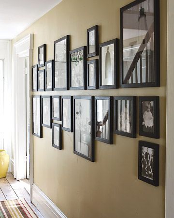 Mark a horizontal midline on the wall, and hang all pictures above or below it..