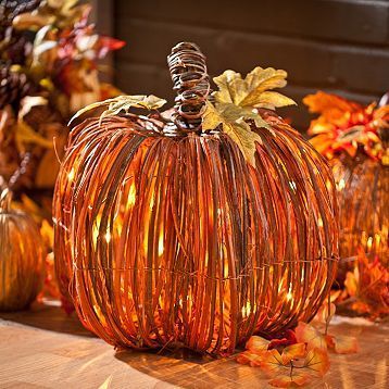 Our Pre-Lit Natural Rattan Pumpkin is the perfect fall piece to light up your ho