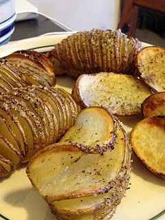 Slice whole potatoes almost all the way through, so that the slices are all stil