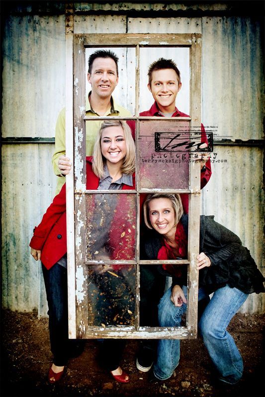 Use an old window for family photos.  I love this idea!!