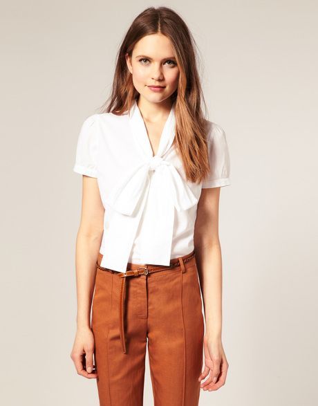 white blouse and camel pants