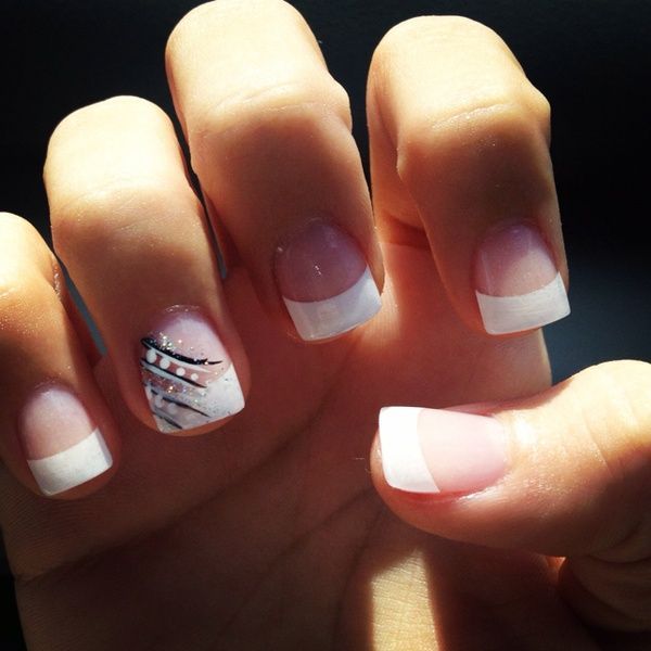 French tip acrylics with design on the ring finger