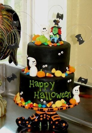 Halloween cake:  Black fondant covered cake, ghosts, frog, pumpkins, bats all ma