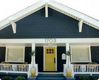 navy house with yellow door and white trim! I love these colors.
