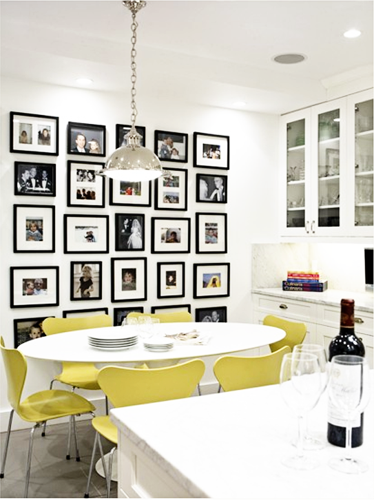 photo wall for the kitchen: brightly color chairs, white decor, and B photos in