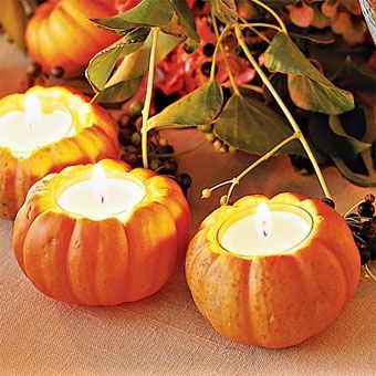 Use mini pumpkins from Halloween to decorate for the fall by carving out a hole