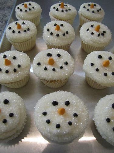 Snowman Cupcakes! Dip the white-iced cupcake in sugar crystals to make it look l