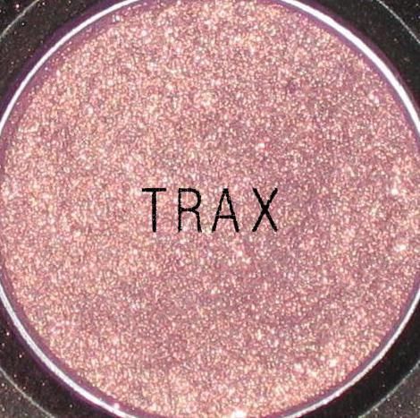 My all time-favorite MAC eyeshadow: Trax. A purply shade with gold flecs.. Perfe