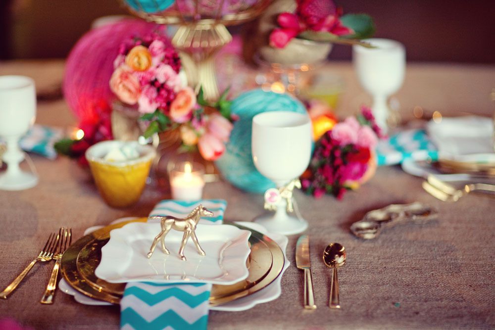 Color palette: white, gold, turquoise and shades of pink.