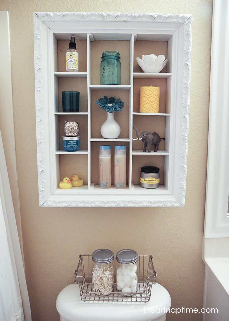 DIY bathroom makeover! I love these framed shelves!