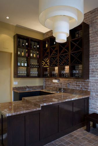 exposed brick with dark contemporary cabinets and light countertop, wine bar