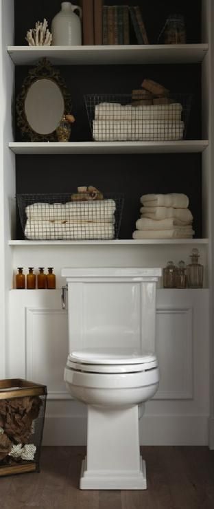 Great use of space. Small bathnroom design with built-in shelves with backs of s