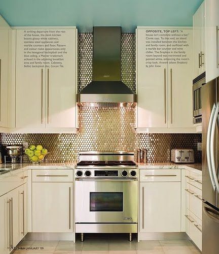 Im dying over this kitchen. Simple white cabinets with long stainless pulls. And