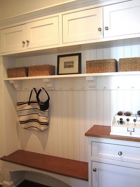 love the details in this entryway storage Perfect mix of seating, purse storage,