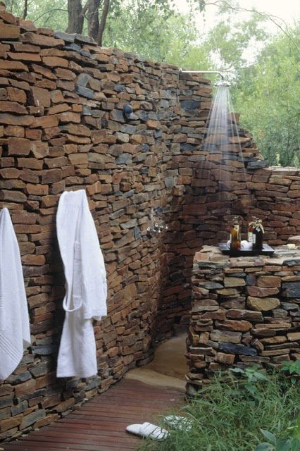 Natural stone outdoor shower. No more de-cloging the drain in your tub after was