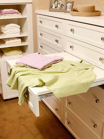 Pull-out drawer provides a flat surface for folding clothes and/or drying delica