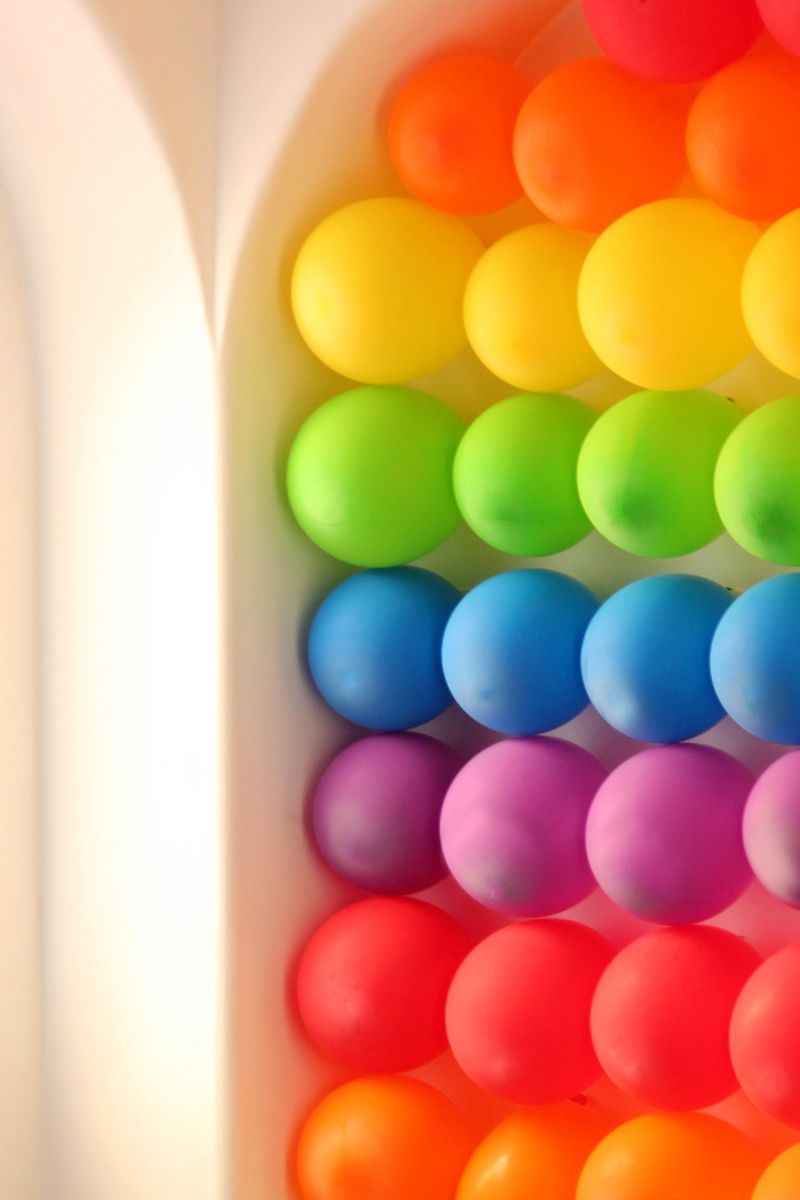 Rainbow Balloon Wall .. Fill each balloon with paint and tape them to a large ca