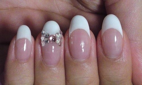Rounded nails with french mani & bow.