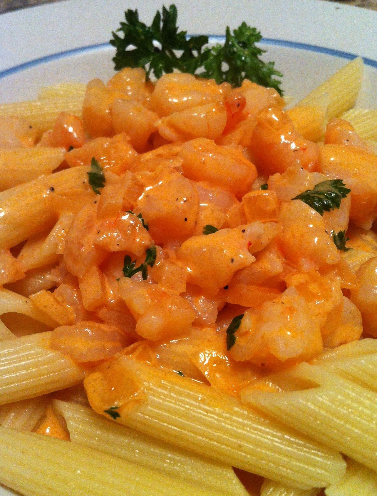 Shrimp pasta with tomato cream sauce. Shrimp, pasta, cream, tomato sauce, onions
