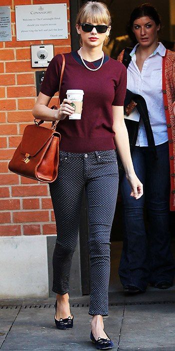 Taylor Swift styled her polka-dot denim with a maroon topper.