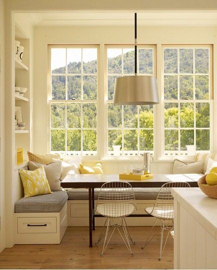 A corner banquette provides ample seating for guests and also saves room. Add cu