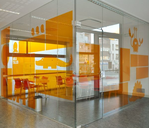 Biblioteca del Sud signage system #signage #glass graphics #orange #window graph