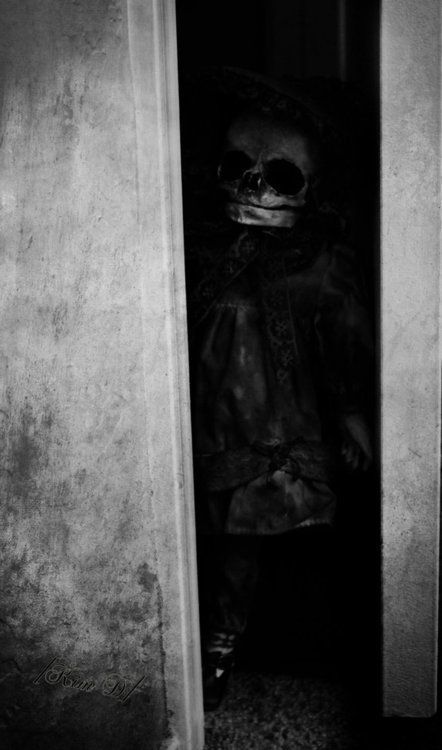 creepy shot of little girl with mask on..Vintage Photo