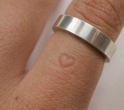 The longer you wear the ring, the heart will permanently leave a mark on the fin
