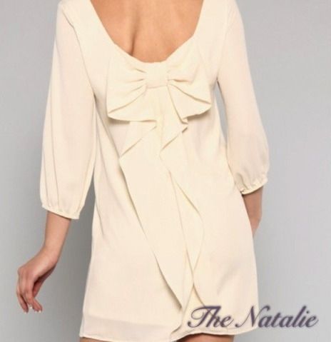 The Natalie is an ivory boat-neck shift dress featuring the fan-favorite cascadi