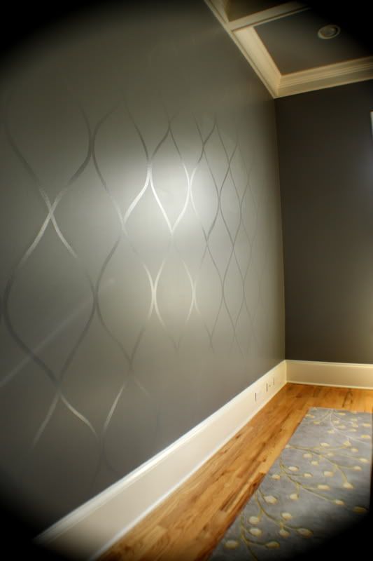 Use a high gloss paint over top of a flat paint to create a subtle design. This