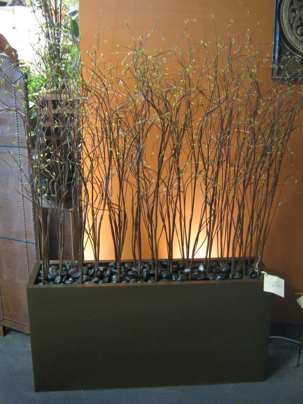 Willow branches and river rock for my planter boxes to provide privacy around th