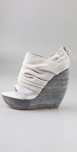 Can anyone tell me who makes this Wedge shoe? I really want them!